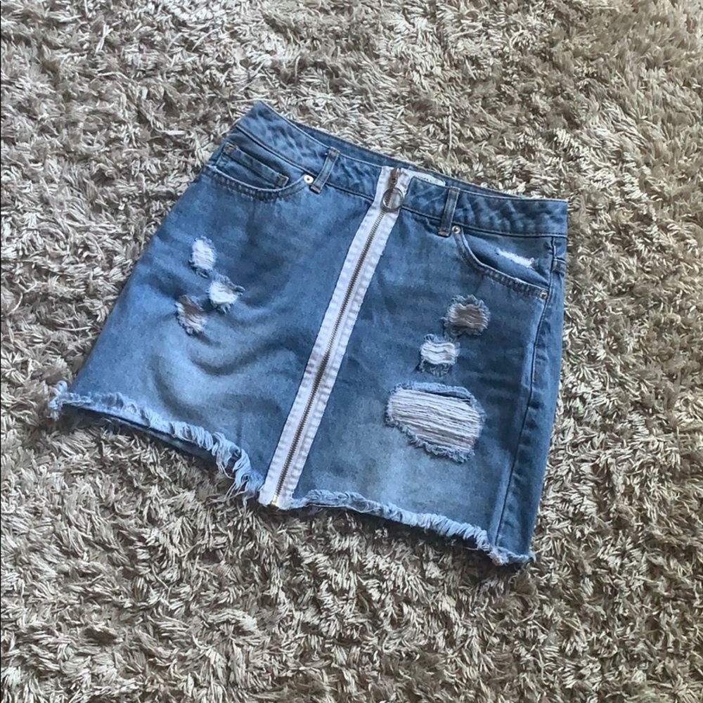 this is a light wash denim zip up skirt